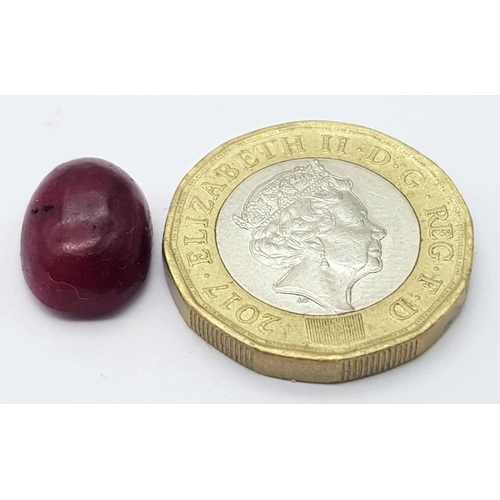 872 - A 9.30 Ct Cabochon Colour Enhanced African Natural Ruby, Oval Shape. Comes with the GLI Certificate.... 