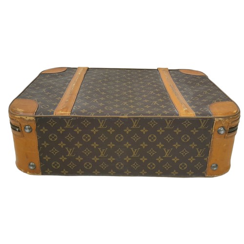 30 - A Louis Vuitton Vintage Small Suitcase. Monogrammed canvas exterior with leather trim, gold-toned ha... 