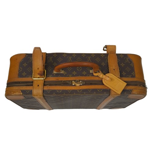 30 - A Louis Vuitton Vintage Small Suitcase. Monogrammed canvas exterior with leather trim, gold-toned ha... 