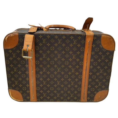 30 - A Louis Vuitton Vintage Small Suitcase. Monogrammed canvas exterior with leather trim, gold-toned ha... 