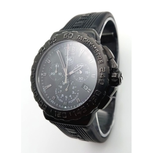 197 - A Tag Heuer Formula 1 Chronograph Gents Quartz Watch. Black Tag rubber strap. Black dial with three ... 