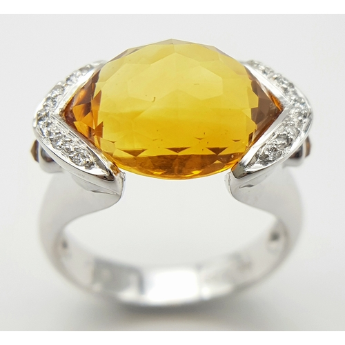 8 - An 18K White Gold Citrine and Diamonds Ring. Size N1/2, 7.58g total weight.