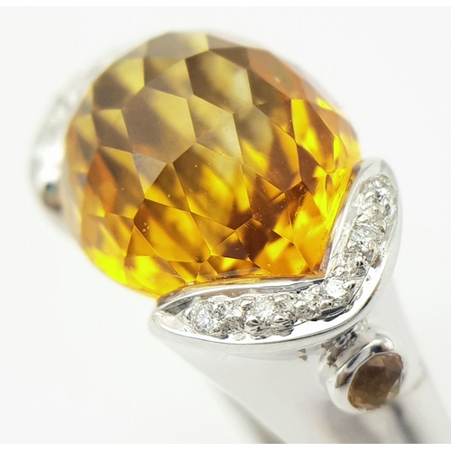 8 - An 18K White Gold Citrine and Diamonds Ring. Size N1/2, 7.58g total weight.