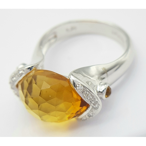 8 - An 18K White Gold Citrine and Diamonds Ring. Size N1/2, 7.58g total weight.