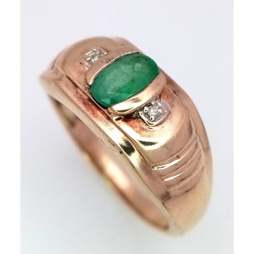 16 - A 9K Yellow Gold Emerald and Diamond Ring. Oval cut emerald with a diamond either side. Size T 1/2. ... 