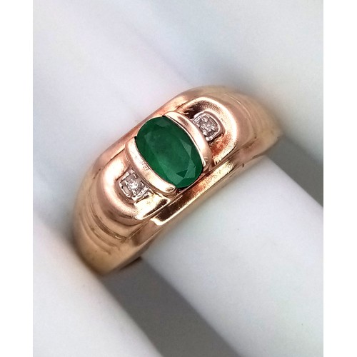 16 - A 9K Yellow Gold Emerald and Diamond Ring. Oval cut emerald with a diamond either side. Size T 1/2. ... 