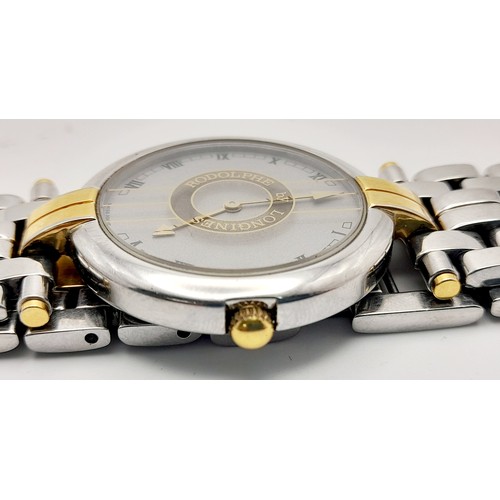 136 - A Longine Rodolph Quartz Gents Watch. Two tone bracelet and case - 33mm. Silver tone dial. In workin... 