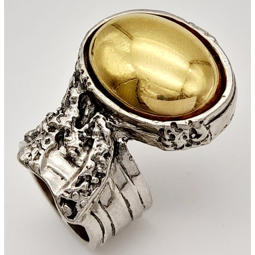 239 - A Designer Yves Saint Laurent Artistic Ring. Size N.