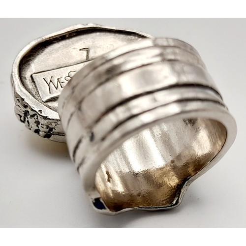 239 - A Designer Yves Saint Laurent Artistic Ring. Size N.