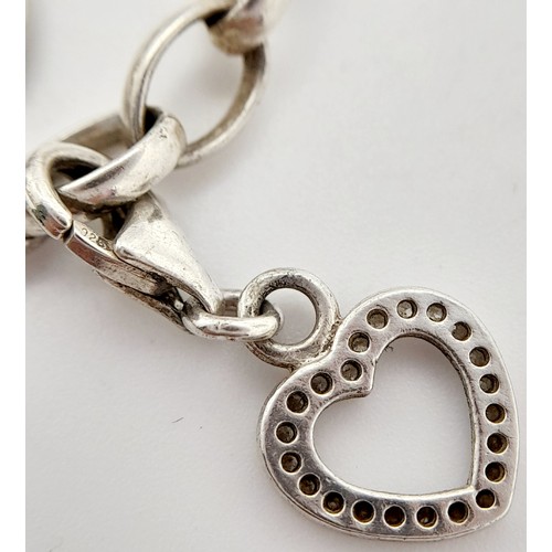 323 - A Thomas Sabo CHARM CLUB 925 Silver Charm Bracelet. Charms to include initial L, open heart, engagem... 