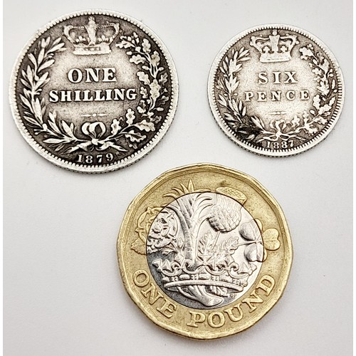 698 - An 1879 Silver shilling and an 1887 silver sixpence. Please see photos for conditions.