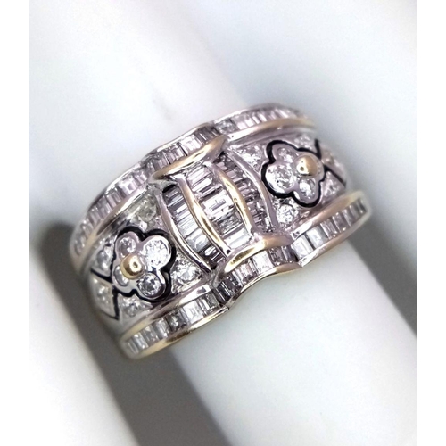 129 - An 18K White Gold Decorative Diamond Ring. Seventy Round and rectangular cut diamonds create an arti... 