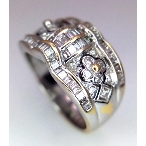 129 - An 18K White Gold Decorative Diamond Ring. Seventy Round and rectangular cut diamonds create an arti... 