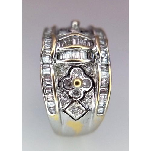 129 - An 18K White Gold Decorative Diamond Ring. Seventy Round and rectangular cut diamonds create an arti... 