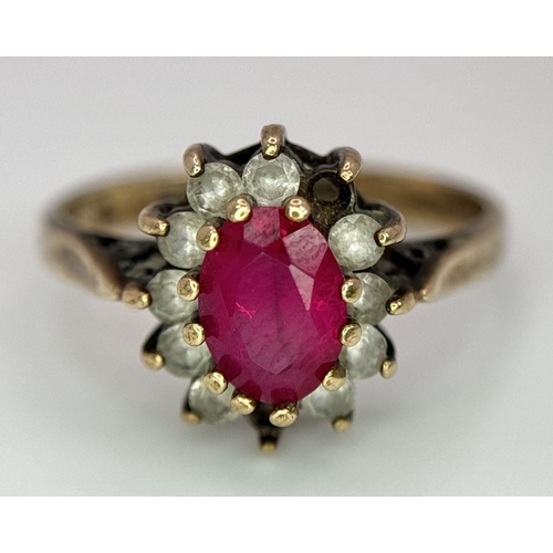 169 - A Vintage 9K Yellow Gold Ruby and Diamond Ring. Two small diamonds missing from halo. Size J. 2.5g t... 