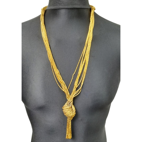 227 - An Aurelie Bidermann Gilded Statement Decorative Knot Necklace. 70cm