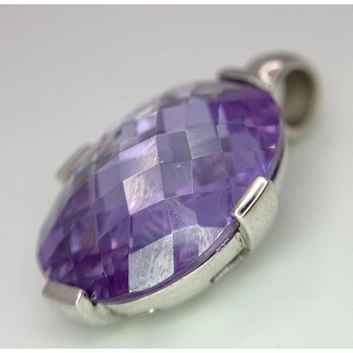 640 - A Large Faceted Amethyst Oval Cut Stone set in 925 Silver. 3cm.