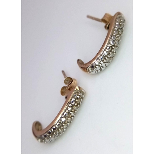 98 - Stunning Pair of 9 carat GOLD and DIAMOND EARRINGS. Both Earrings having a line of 8 x DIAMONDS to c... 