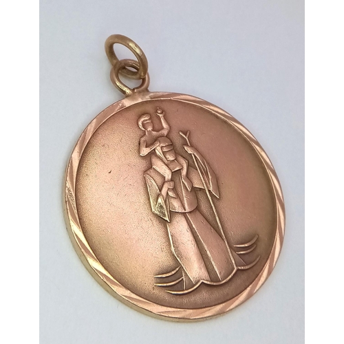 10 - A Vintage 9K Yellow Gold St. Christopher Pendant. 3.5cm. 7.7g.