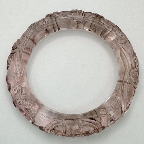 104 - A spectacular rock crystal bangle with exquisite Chinese hand carving in its original presentation b... 