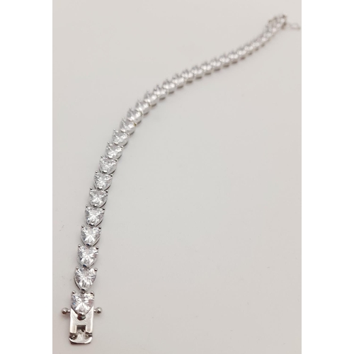 1396 - A Fancy Silver Plated White Zircon Tennis Bracelet. 17cm.