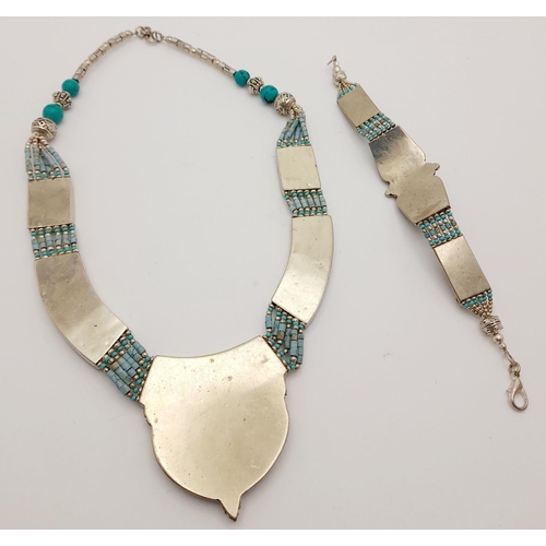 146 - A native American (Navaho or Zuni?) white metal and turquoise necklace and bracelet set in a present... 