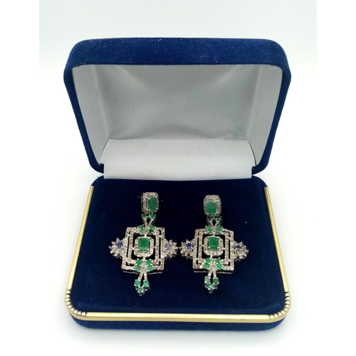 153 - An antique, regal, sterling silver pair of earrings with large emeralds and old cut diamonds, in a l... 