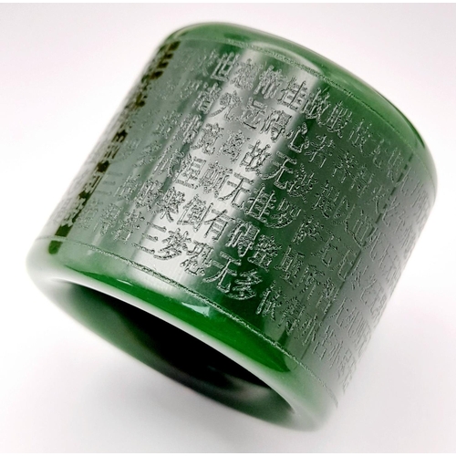 160 - Of Buddhist interest: A green jade set consisting of a bangle, a thumb ring and a pendant/amulet wit... 