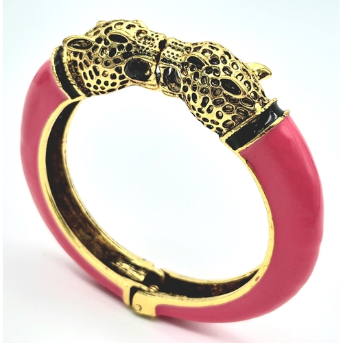 167 - A vintage, designer style, double panther bangle, gold tone with pink enamel, in excellent new/unuse... 