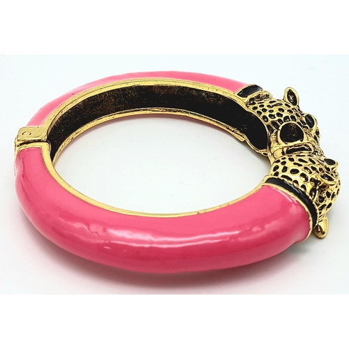 167 - A vintage, designer style, double panther bangle, gold tone with pink enamel, in excellent new/unuse... 