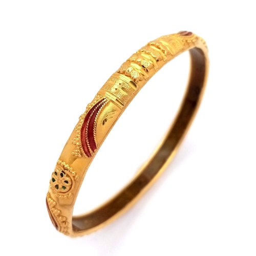 2 - An Asian Inspired 22k Yellow Gold Bangle. Emerald and ruby decoration. Silicone liner. 15.75g total ... 