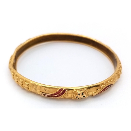 2 - An Asian Inspired 22k Yellow Gold Bangle. Emerald and ruby decoration. Silicone liner. 15.75g total ... 