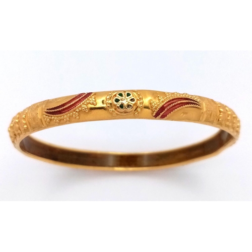 2 - An Asian Inspired 22k Yellow Gold Bangle. Emerald and ruby decoration. Silicone liner. 15.75g total ... 