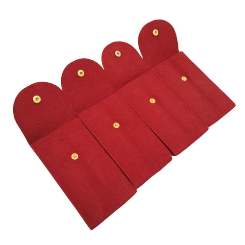 265 - A group of four OMEGA service pouches with inserts, ideal for keeping your precious watches well pro... 