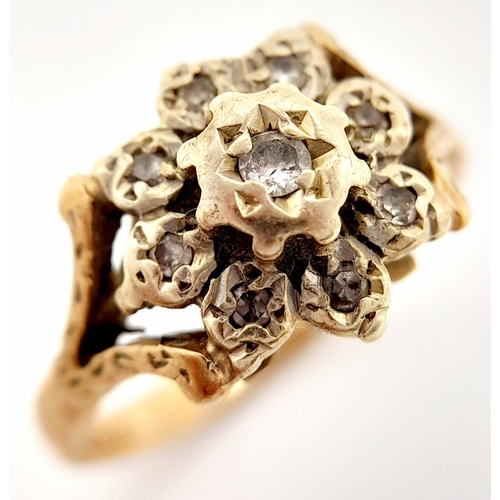 57 - A Vintage 9K Yellow Gold and Diamond Ring. Old cut diamonds in a floral decoration. Size L. 3.1g tot... 