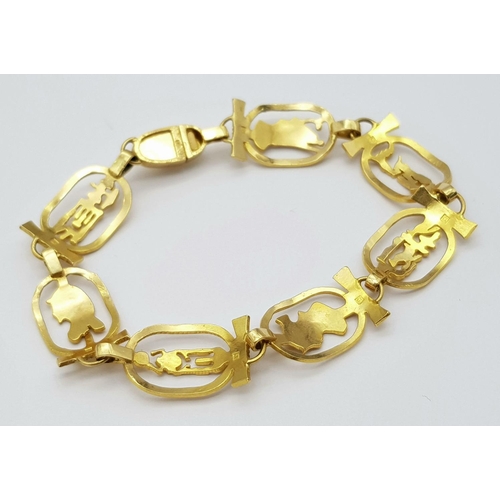 59 - An 18K Yellow Gold Egyptian Themed Bracelet. 17cm. Hallmarks for 18k gold Cairo. 19.15g.