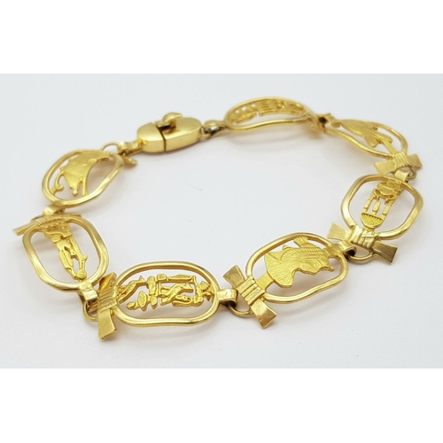 59 - An 18K Yellow Gold Egyptian Themed Bracelet. 17cm. Hallmarks for 18k gold Cairo. 19.15g.