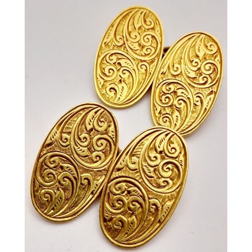 68 - A Pair of Vintage 18K Yellow Gold Oval Cufflinks. Decorative scrolled engraving. 12.4g total weight.