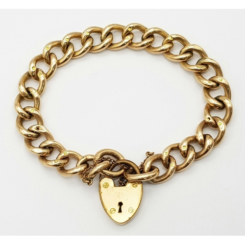 8 - A Vintage 9K Yellow Gold Curb Bracelet with Heart Clasp. Multiple hallmarks. 17cm. 16.14g