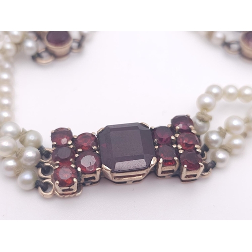 207 - An Antique 9K Gold (tested), Garnet and Pearl Bracelet. Different cuts of rich garnet gemstones amon... 