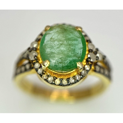 1400 - A 2ct Emerald ring with Diamond Accents. Set in gilded 925 Silver. Size K.