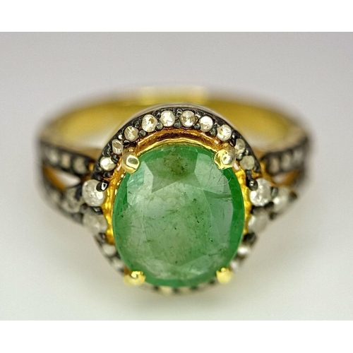 1400 - A 2ct Emerald ring with Diamond Accents. Set in gilded 925 Silver. Size K.