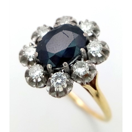 150 - An 18K Yellow Gold (tested) Sapphire and Diamond Ring. A central 4ct central oval cut sapphire with ... 