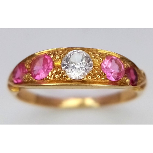 157 - A 22K Yellow Gold Ruby and Diamond Ring. A central diamond with two beautiful rubies either side. Si... 