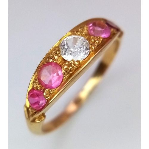 157 - A 22K Yellow Gold Ruby and Diamond Ring. A central diamond with two beautiful rubies either side. Si... 