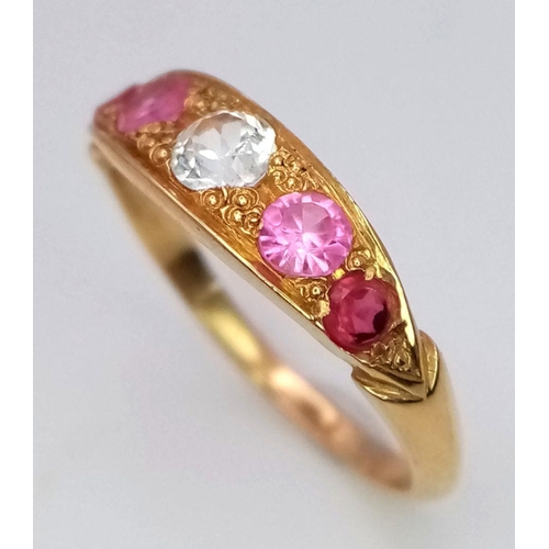 157 - A 22K Yellow Gold Ruby and Diamond Ring. A central diamond with two beautiful rubies either side. Si... 