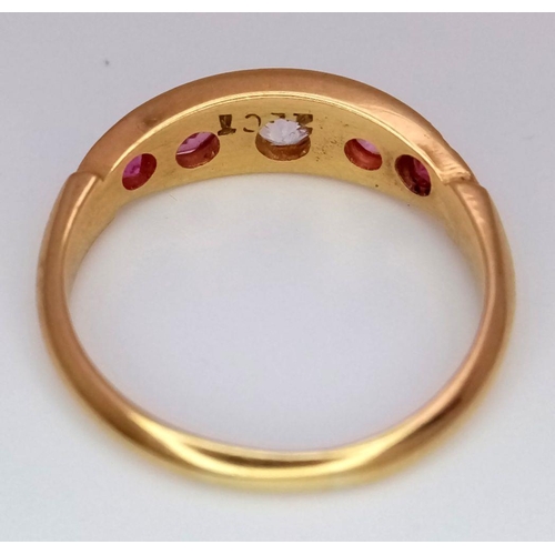 157 - A 22K Yellow Gold Ruby and Diamond Ring. A central diamond with two beautiful rubies either side. Si... 