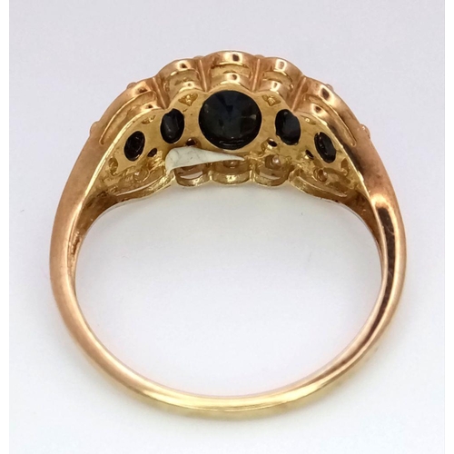 163 - A 9K Yellow Gold Sapphire and Diamond Ring. Graduated sapphires with diamond accents. Size S. 4.1g t... 