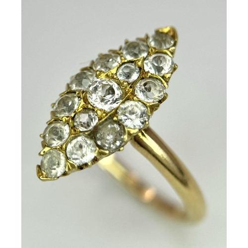 177 - An 18K Yellow Gold Diamond Ring. Marquise shape with 15 diamonds. Size K. 3.4g total weight.