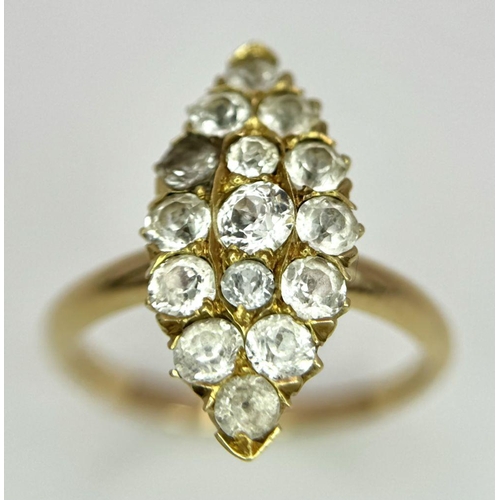 177 - An 18K Yellow Gold Diamond Ring. Marquise shape with 15 diamonds. Size K. 3.4g total weight.